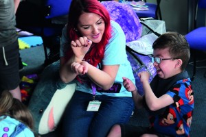Support Worker Kerry enjoys some playscheme fun with SBH Scotland member, Lewis