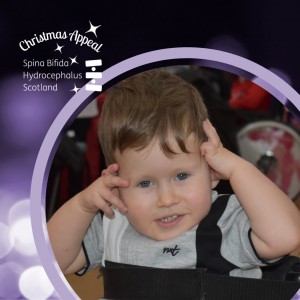 Jack posing for a photo in a Christmas Appeal frame