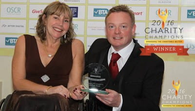 Dr Margo Whiteford and Richard Donald of SBH Scotland receive an award