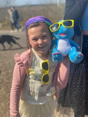 Charity Champion Winner Laila posing for photo with Spiney the Diney Toy during a sponsored walk