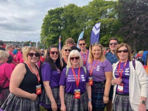 8 staff from Dales Park School Pose for photo at Kiltwalk