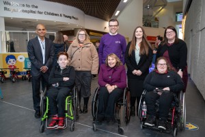Natalie Don MSP poses with Kamath Tallur, Margo Whiteford, Lawrence Cowan and SBH Scotland parents and young people at Transition Clinic event