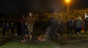 lady walking across firebed at firewalk
