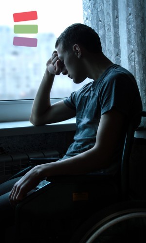 man looking sad at a window