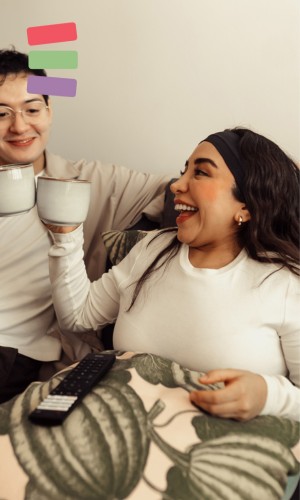 girl smiling holding up a tea cup